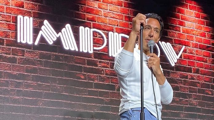 Dr Alex Morizio on stage at the Improv Boost TV